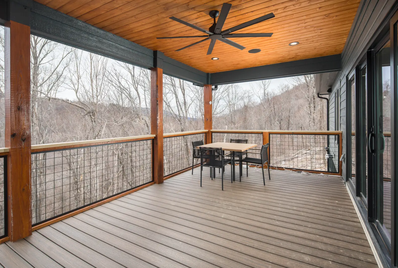 Screened porch with tongue-and-groove wood ceiling overlooking the Blue Ridge Mountains